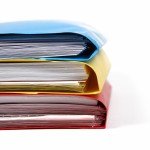 stack of colorful binders in a office
